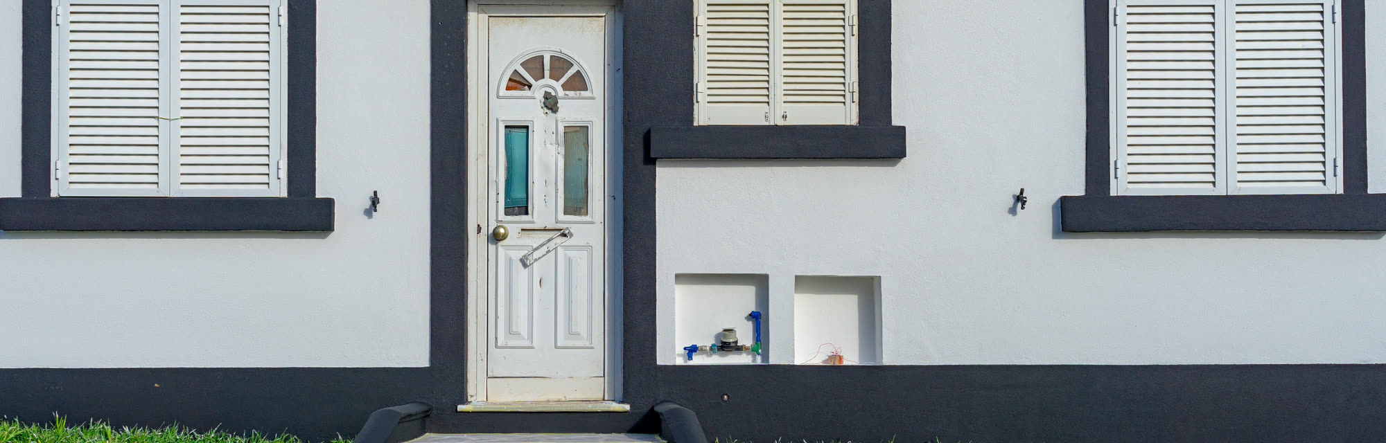 The exterior of a renovated house prepared for sale